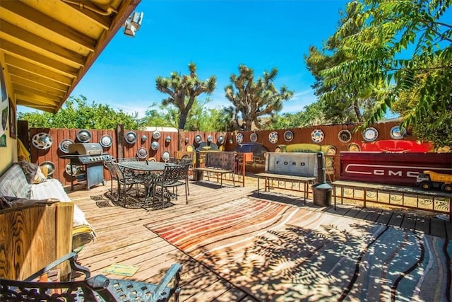 wooden terrace with area for grilling