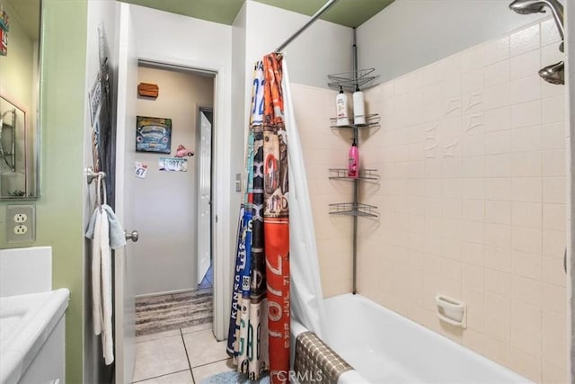 bathroom with tile patterned flooring, vanity, and shower / bath combo