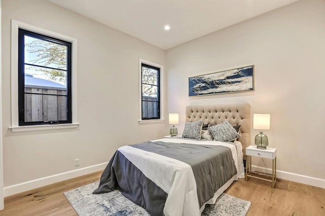 bedroom with light hardwood / wood-style flooring