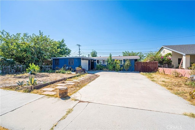 single story home featuring a garage