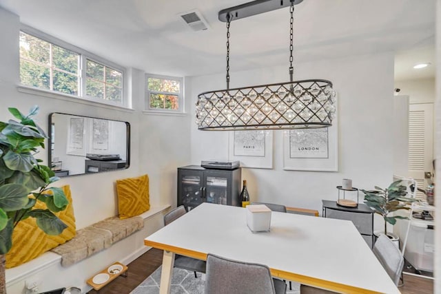 dining area featuring dark hardwood / wood-style flooring