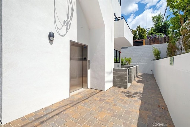 view of patio featuring elevator