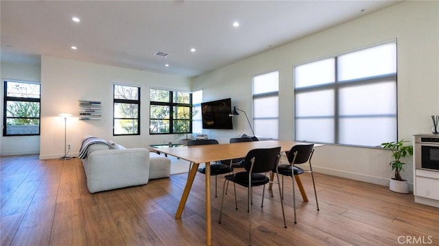 dining area featuring light wood-type flooring