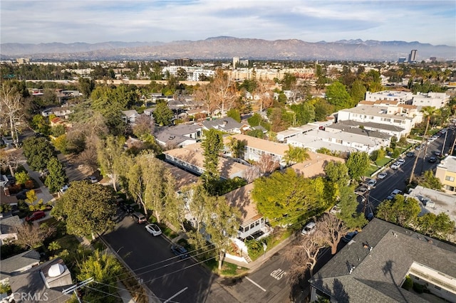 birds eye view of property featuring a mountain view