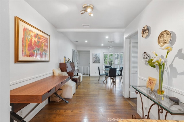 corridor featuring dark hardwood / wood-style flooring