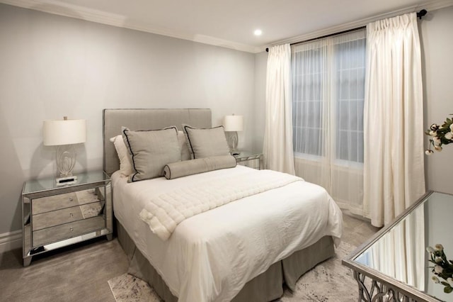 bedroom with light colored carpet and ornamental molding