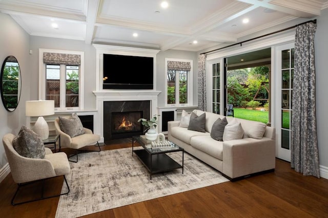 living room featuring coffered ceiling, crown molding, wood-type flooring, beamed ceiling, and a premium fireplace