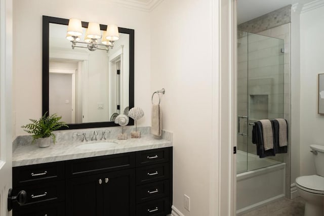 full bathroom with vanity, combined bath / shower with glass door, crown molding, and toilet