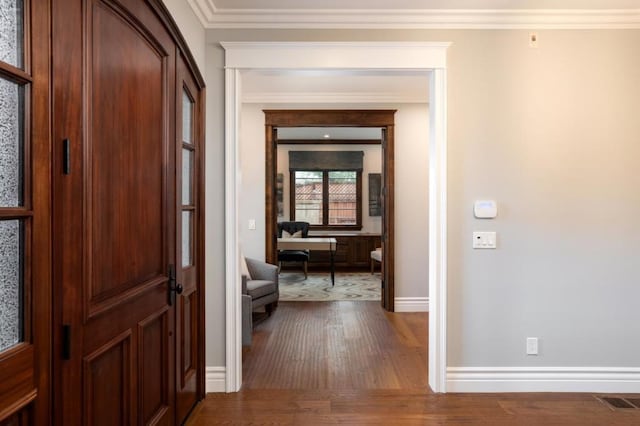 corridor featuring crown molding and wood-type flooring