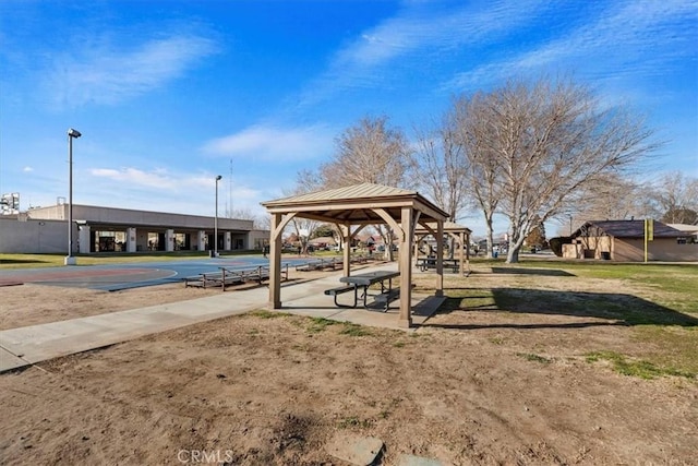 view of home's community with a gazebo and basketball hoop