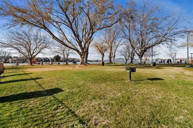 view of home's community with a lawn