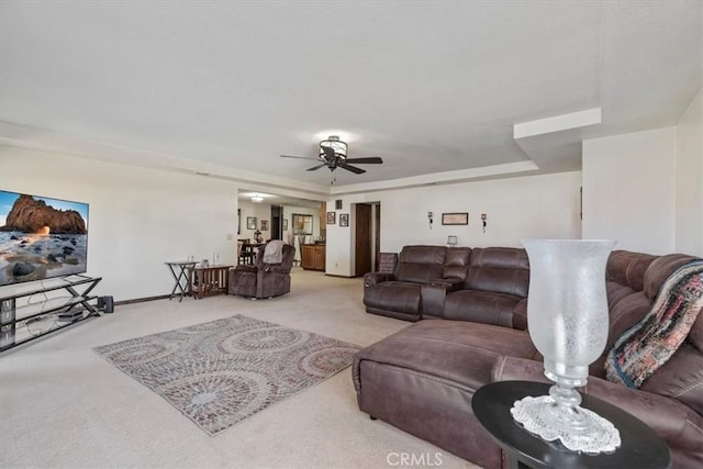 living room with light colored carpet and ceiling fan