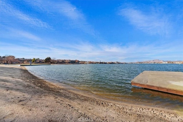 dock area with a view of the beach and a water view