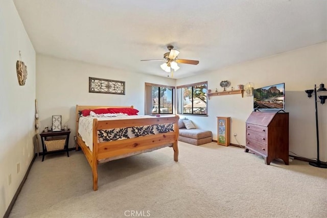 bedroom with light carpet and ceiling fan