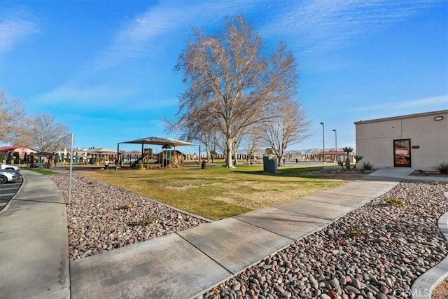 exterior space featuring a playground and a yard