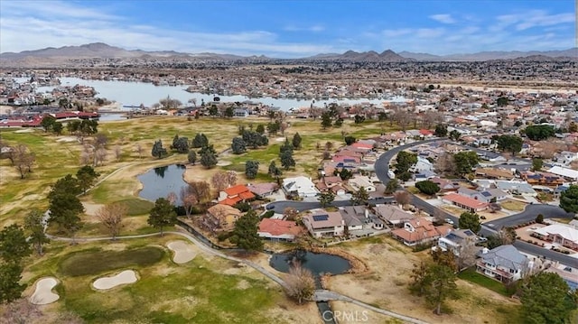 aerial view featuring a water and mountain view