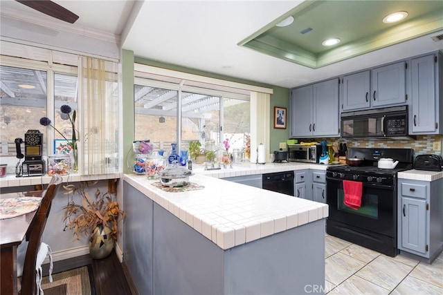 13057 Fescue Ct, Corona, CA 92883 - kitchen with black appliances, a peninsula, decorative backsplash, tile countertops, and ornamental molding