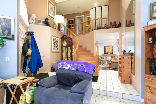 13057 Fescue Ct, Corona, CA 92883 - living area with a high ceiling and stairway