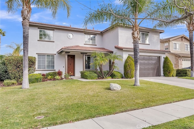 mediterranean / spanish-style home with a garage and a front yard