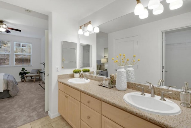 bathroom featuring ceiling fan, tile patterned floors, and vanity