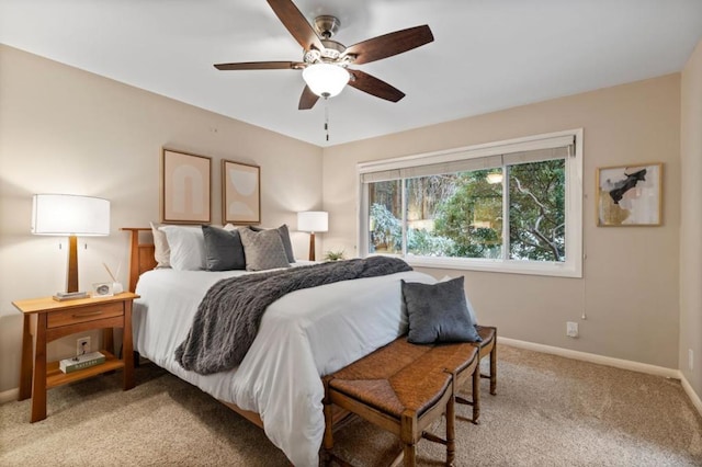 bedroom with ceiling fan and light colored carpet