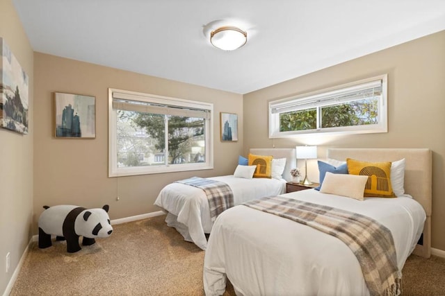 bedroom featuring light colored carpet