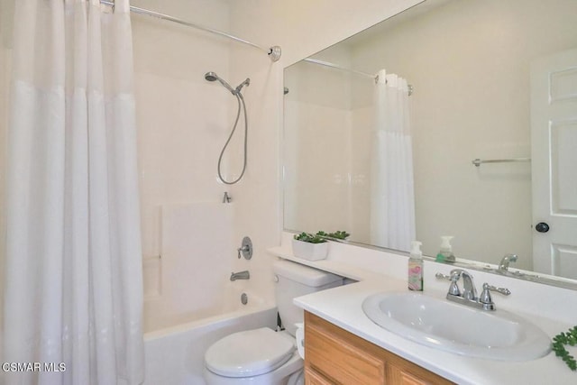 full bathroom with shower / bath combination with curtain, vanity, and toilet