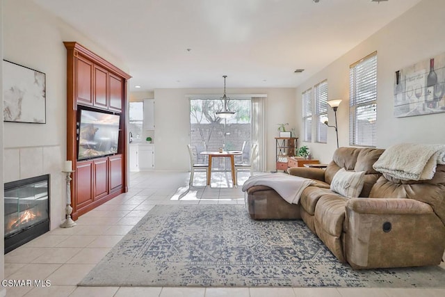 tiled living room featuring a tile fireplace