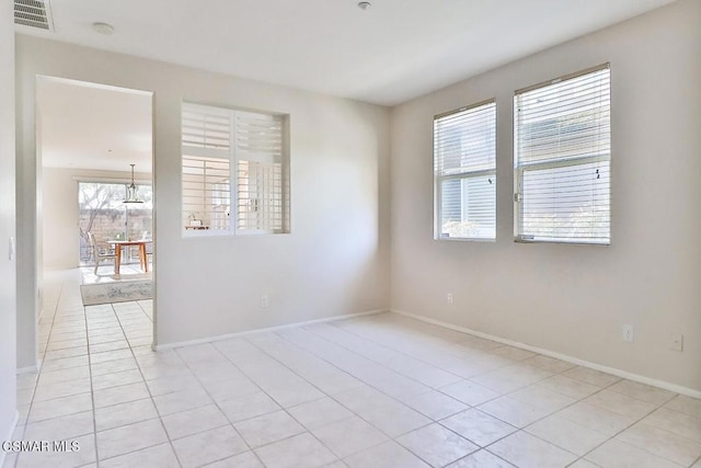 empty room featuring light tile patterned floors