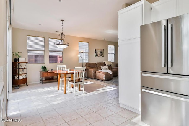 dining area with light tile patterned floors