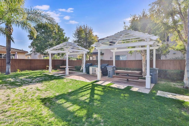 view of yard with a pergola and a patio