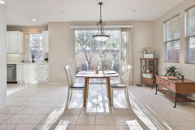 tiled dining space featuring sink