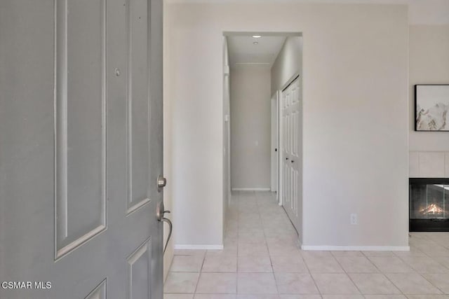 corridor featuring light tile patterned floors