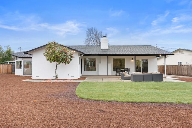 back of house featuring an outdoor living space, a yard, and a patio area