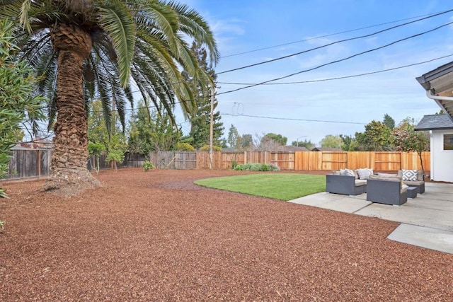 view of yard featuring an outdoor living space and a patio area