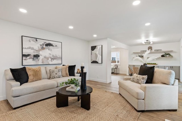 living room with light hardwood / wood-style flooring