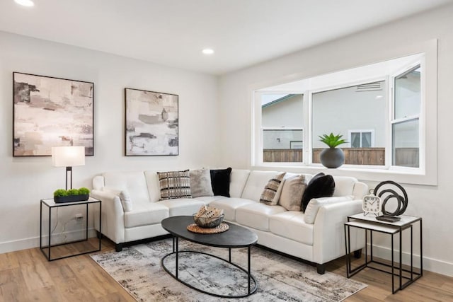 living room with light hardwood / wood-style flooring