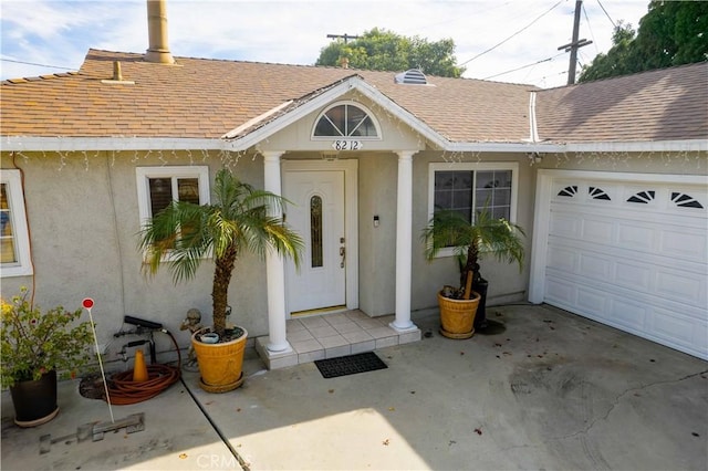 view of exterior entry featuring a garage