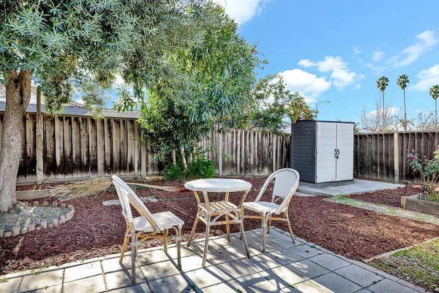 view of patio featuring a shed