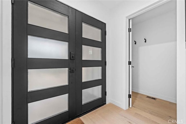 doorway to outside featuring light wood-type flooring