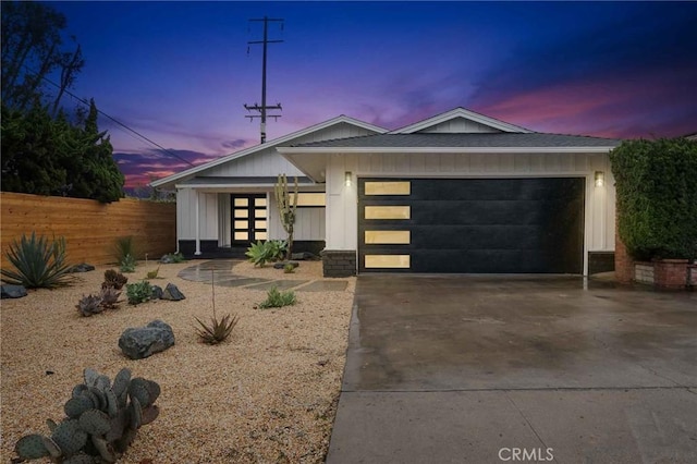 view of front of property with a garage