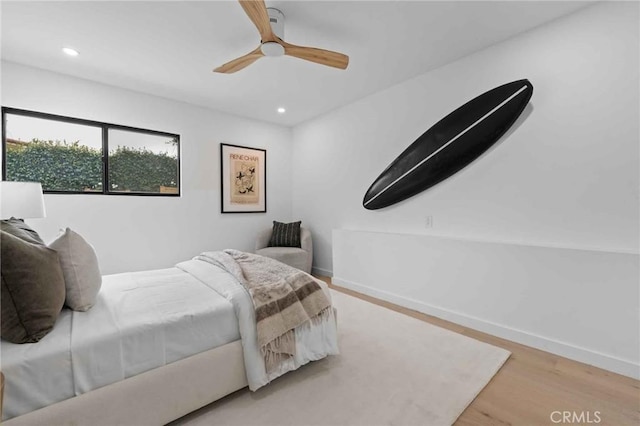 bedroom featuring wood-type flooring and ceiling fan