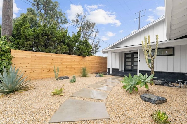 view of yard with french doors