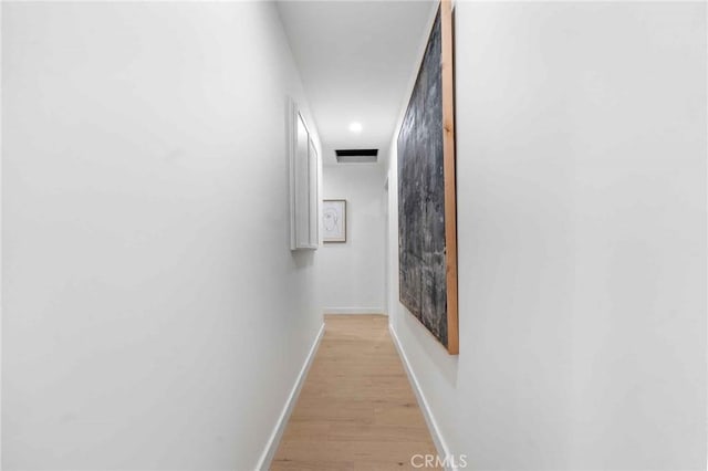 hall with light hardwood / wood-style floors