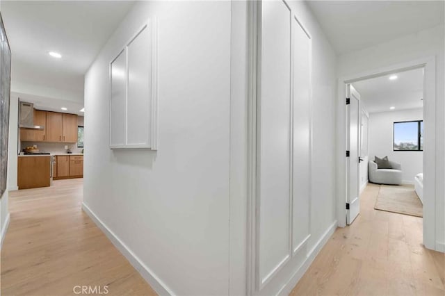 hall featuring light wood-type flooring