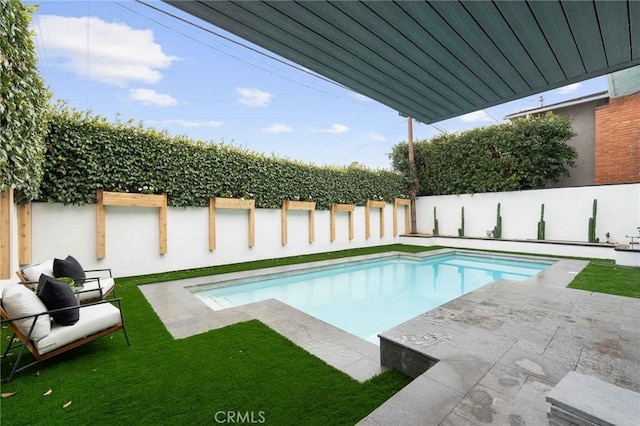 view of swimming pool featuring a patio area