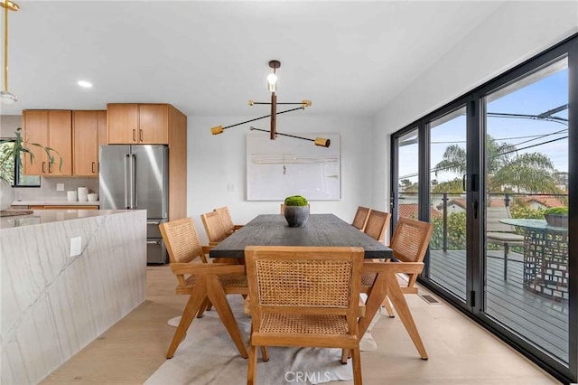 dining space with an inviting chandelier