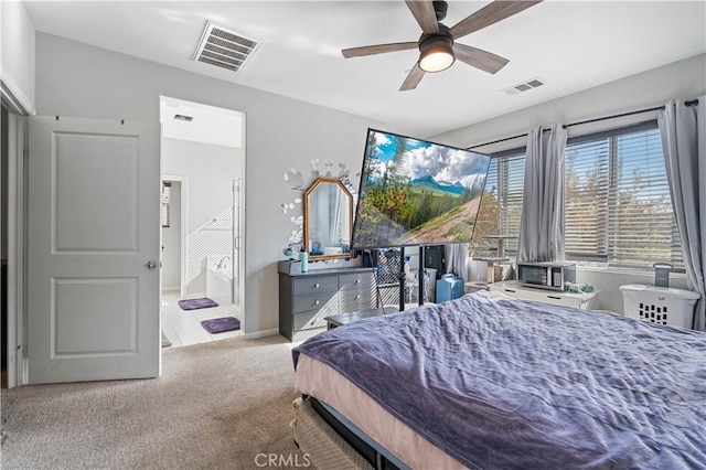 bedroom with ceiling fan and light carpet