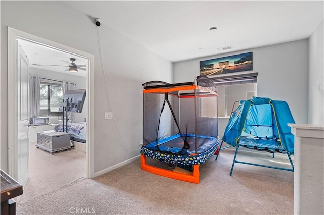 playroom with carpet flooring and ceiling fan