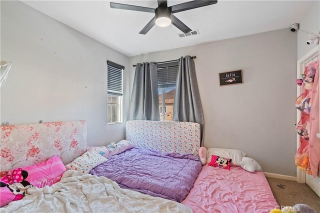 bedroom with ceiling fan and carpet flooring